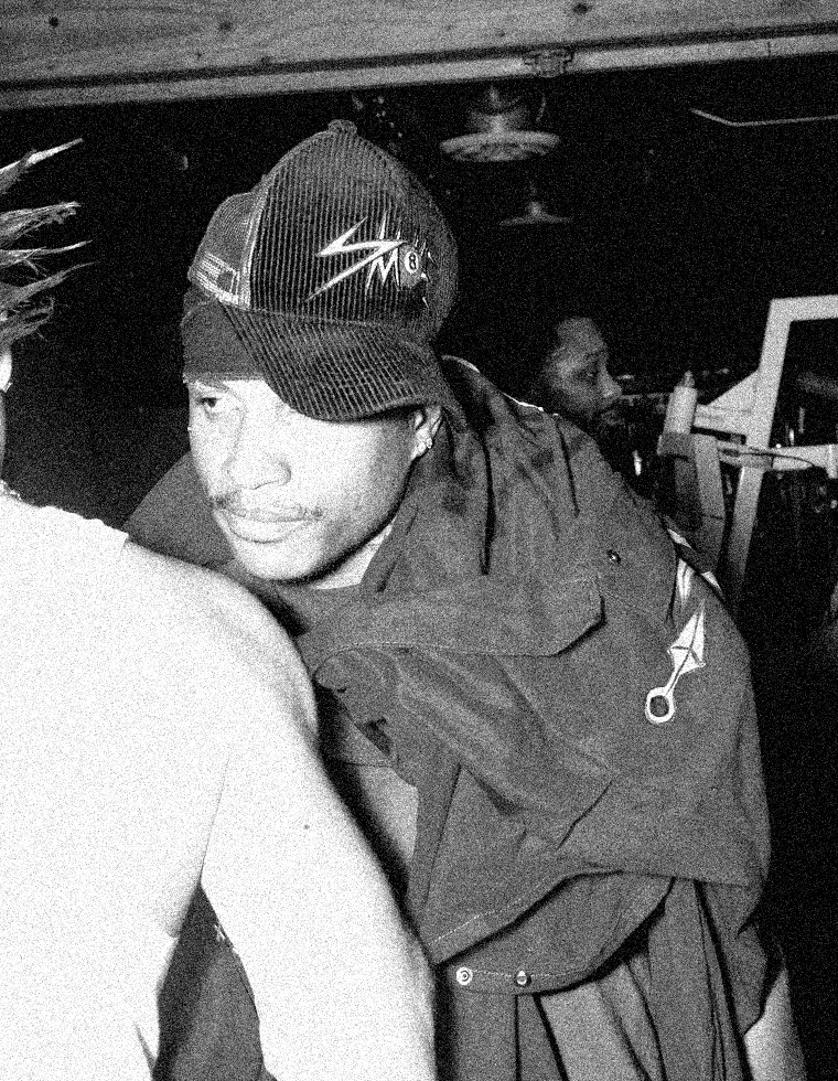 S.A.M.N X in a trucker cap