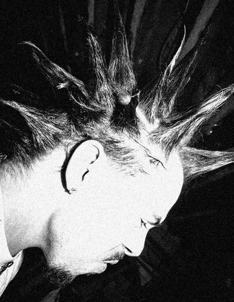 S.A.M.N X, spiked hair, in profile
