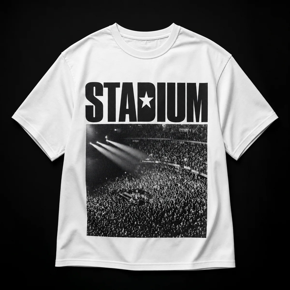 White oversized t-shirt with STADIUM across the chest, a star in place of the D counter, over a halftone print of a stadium crowd