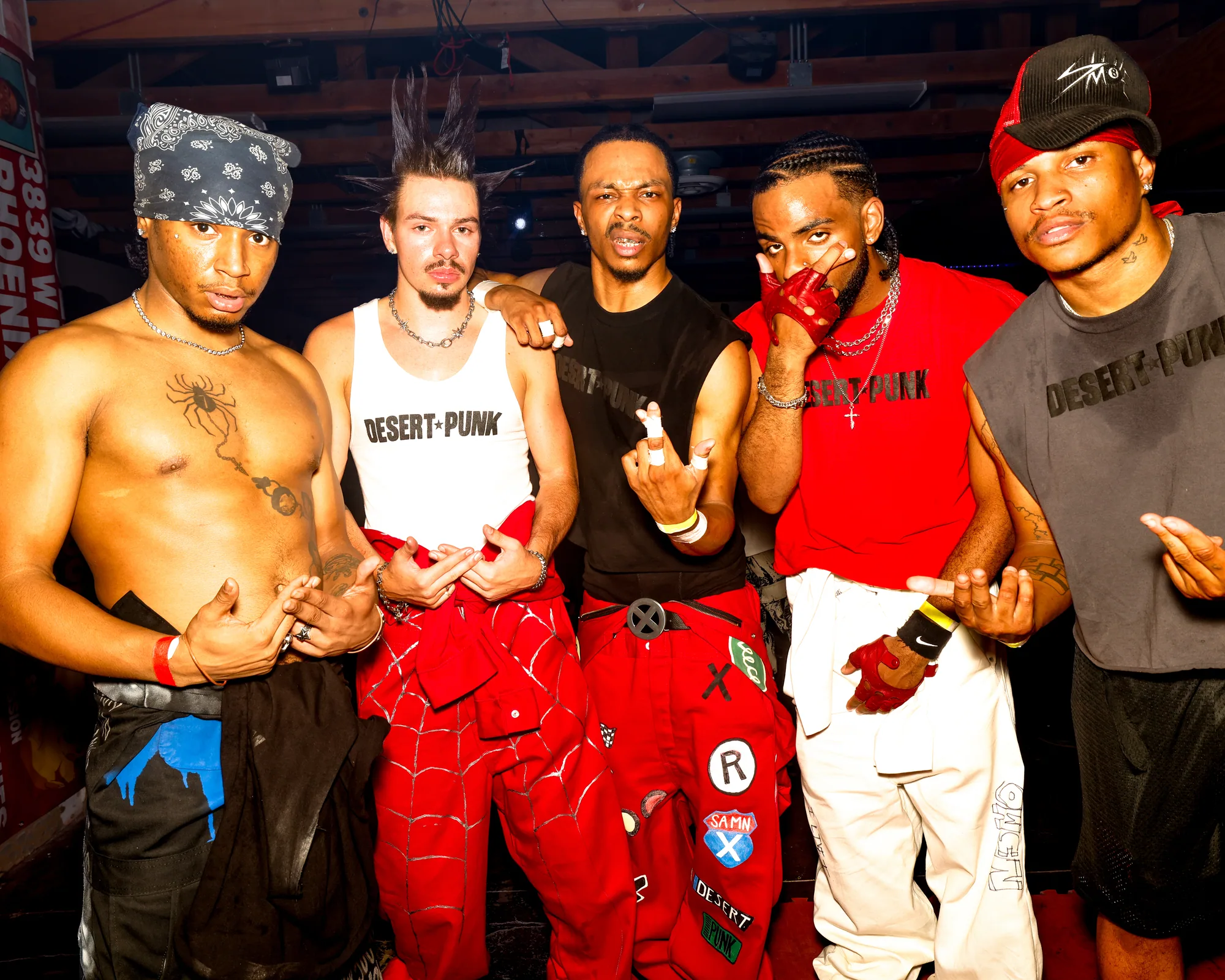 S.A.M.N X, five members in DESERT PUNK shirts, photographed at a Phoenix venue